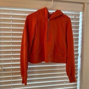 Bright tangerine Lululemon cropped sweatshirt